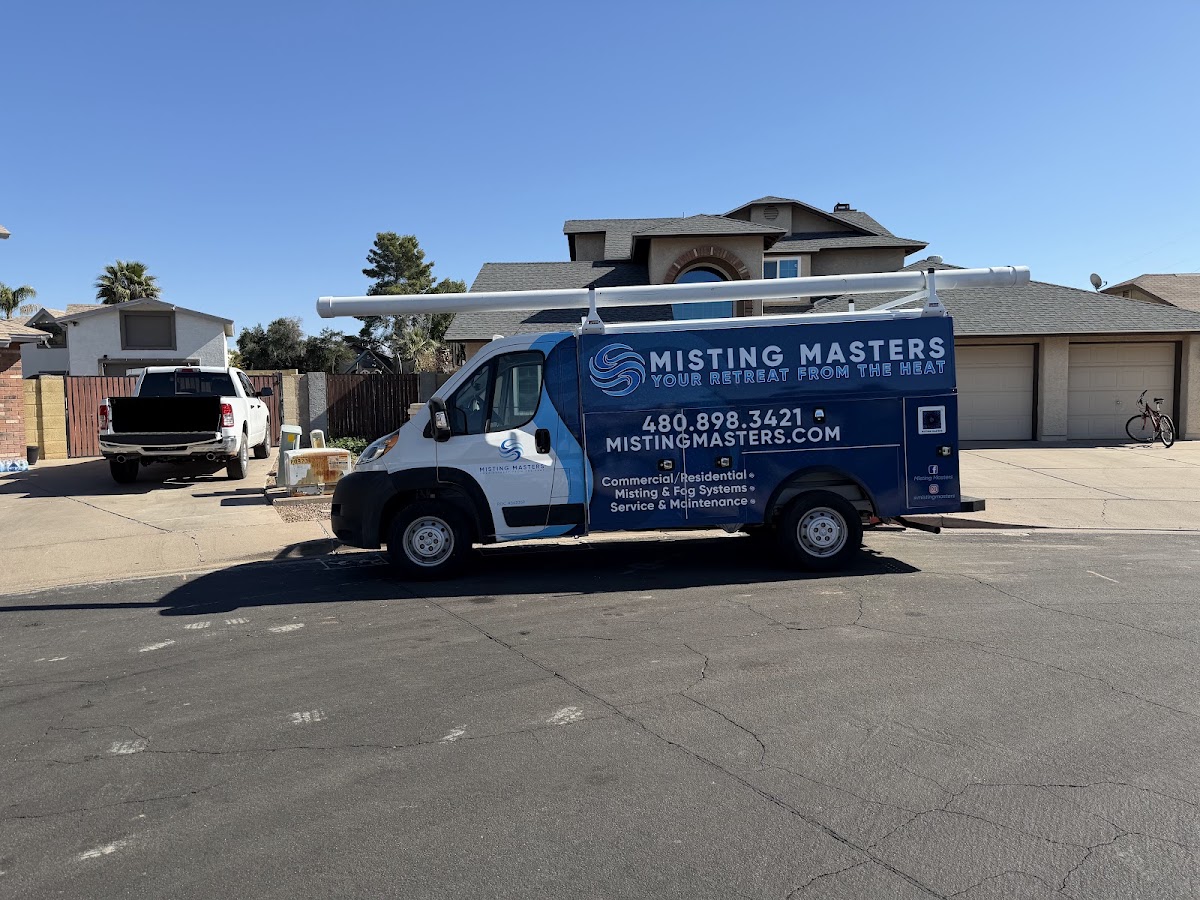 Misting Masters service van Misting Masters branded service van at a residential installation