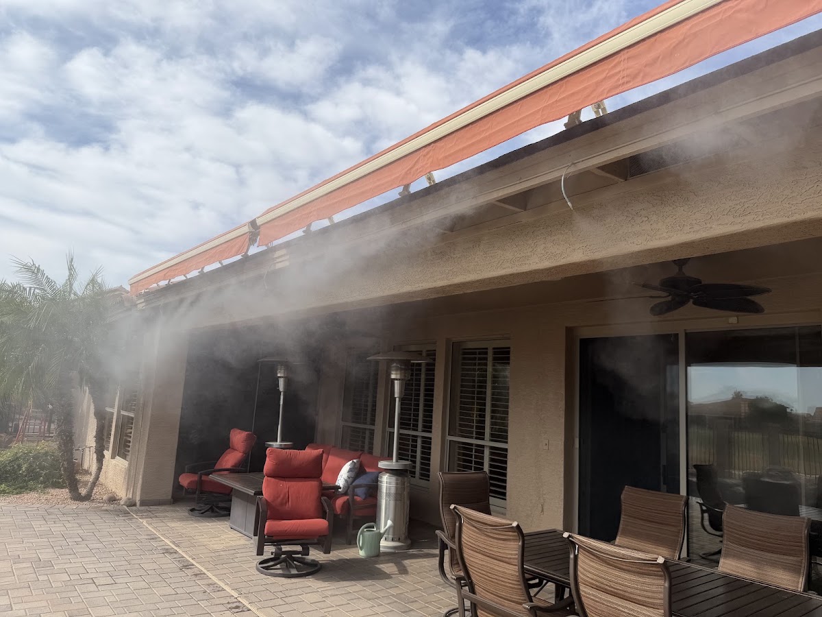 Misting Masters covered patio installation Misting nozzles cooling a covered backyard patio with outdoor seating